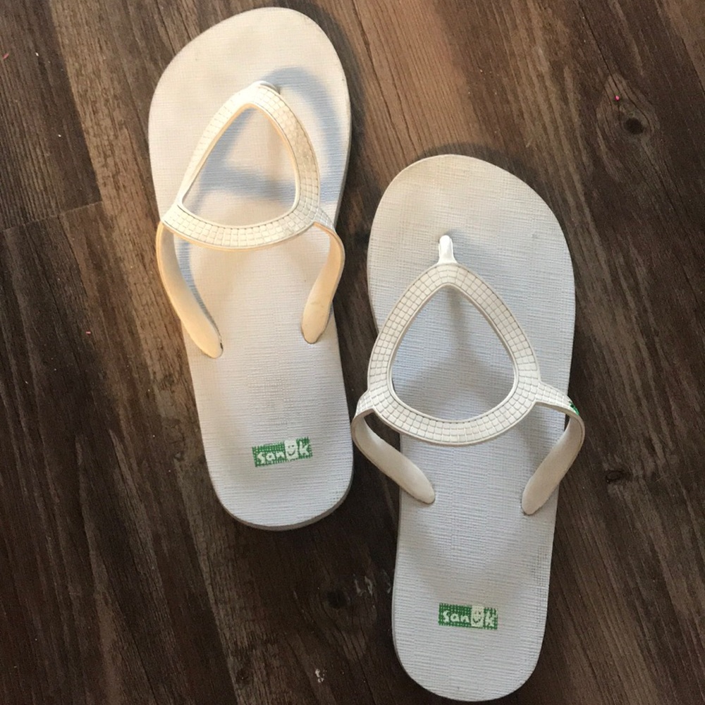 White Sanuk flip flops